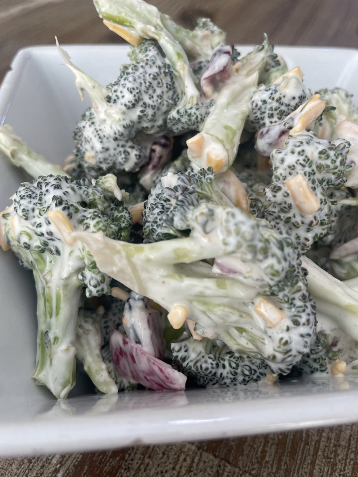 Fresh broccoli salad with red onion and cranberries 